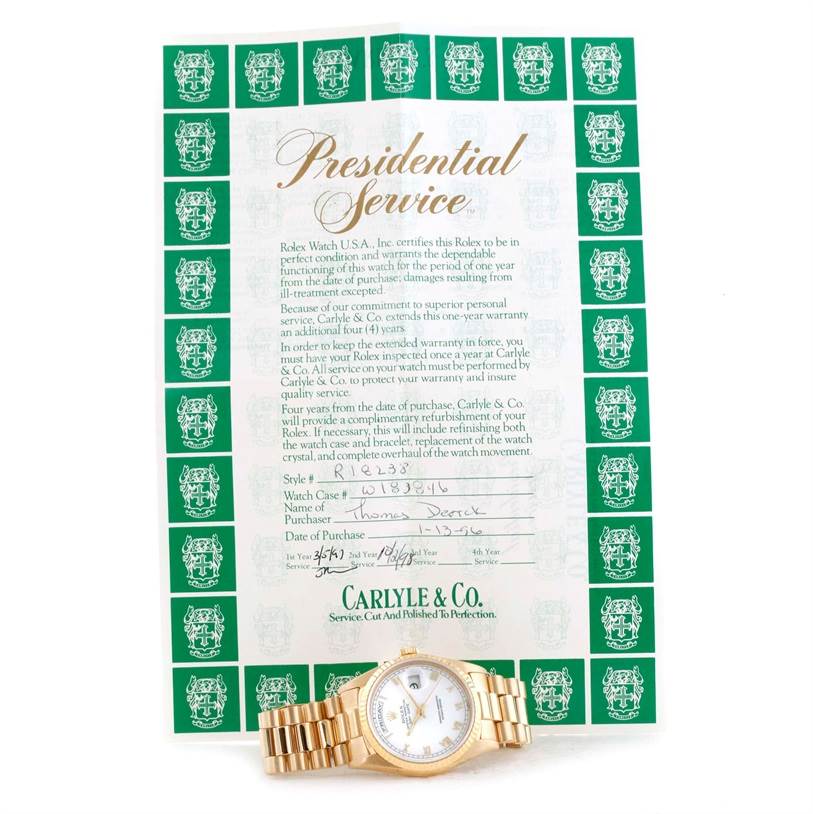 The image shows a Rolex President 18238 Men's Yellow Gold White Dial 18238 Men's Yellow Gold White Dial model watch placed on a "Presidential Service" certificate from Carlyle & Co.