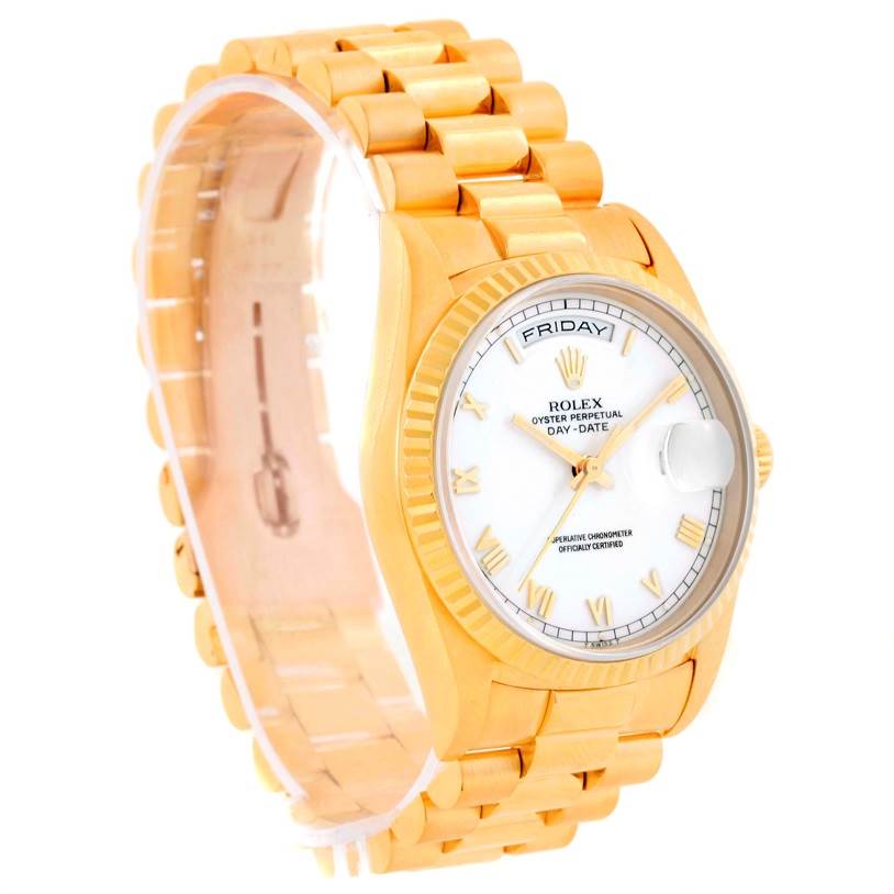 The image shows a President model Rolex watch at an angle highlighting the dial, day-date display, and gold bracelet.