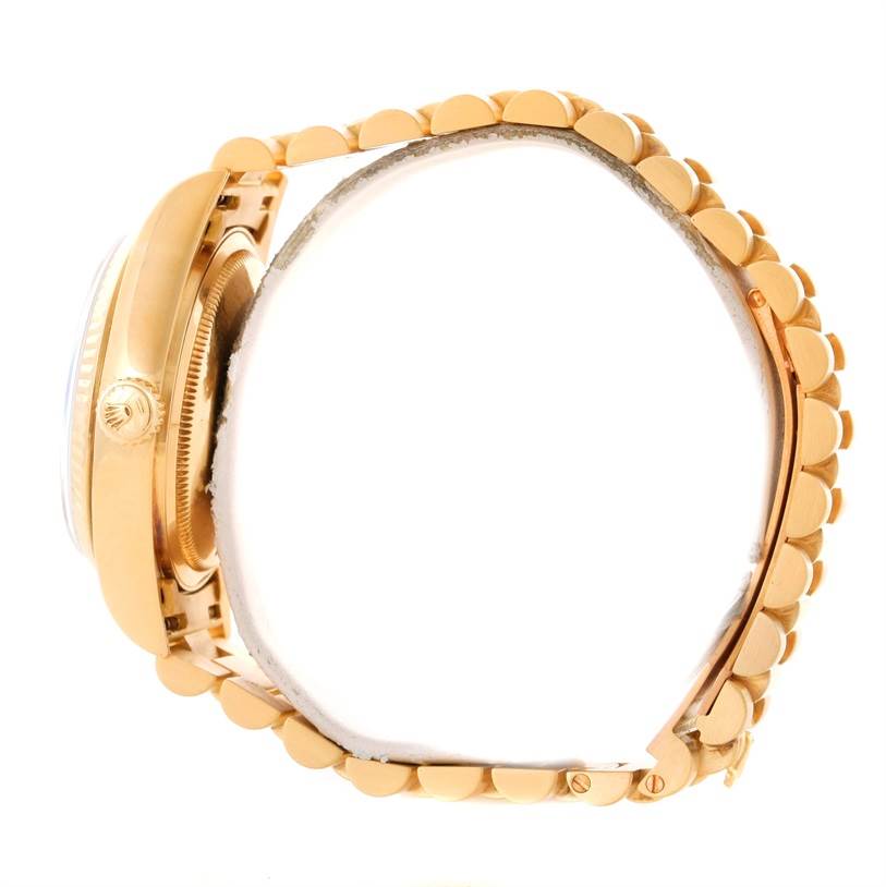 This image shows a side view of a Rolex President 18038 Men's Yellow Gold Black Dial 18038 Men's Yellow Gold Black Dial model watch, focusing on the watch case and bracelet.