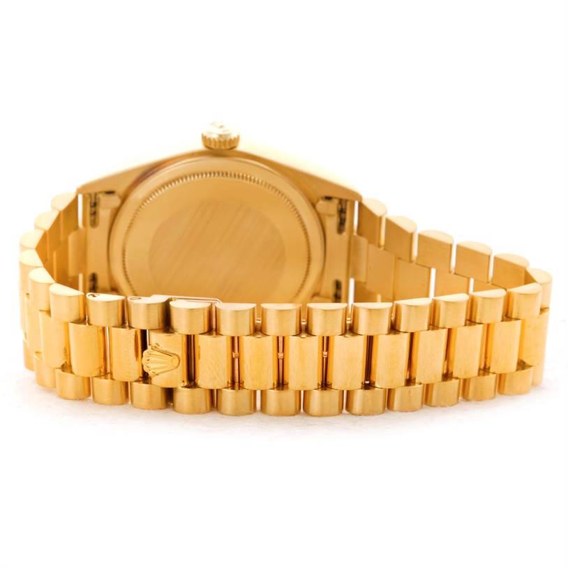 This image shows the back case and bracelet of the Rolex President 18038 Men's Yellow Gold Black Dial 18038 Men's Yellow Gold Black Dial model watch.