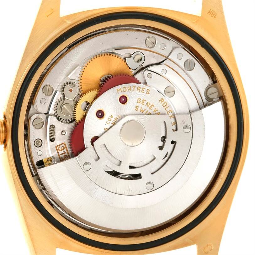 The image shows the inner mechanism and movement of a Rolex President 18238 Men's Yellow Gold Champagne Dial 18238 Men's Yellow Gold Champagne Dial watch from a rear angle.