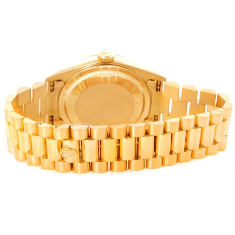 This image shows the back case and bracelet of the President model by Rolex from a rear angle.