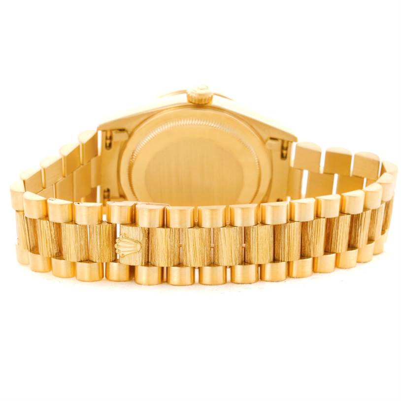 This image shows the back and bracelet of a Rolex President 18308 Men's Yellow Gold White Dial 18308 Men's Yellow Gold White Dial model watch, highlighting the signature gold link design.