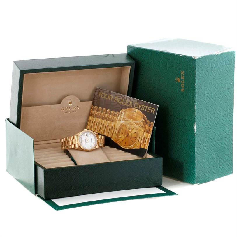 The image shows a Rolex President 18308 Men's Yellow Gold White Dial 18308 Men's Yellow Gold White Dial model watch in its box with the instruction manual, displayed at an angle from the front-right.