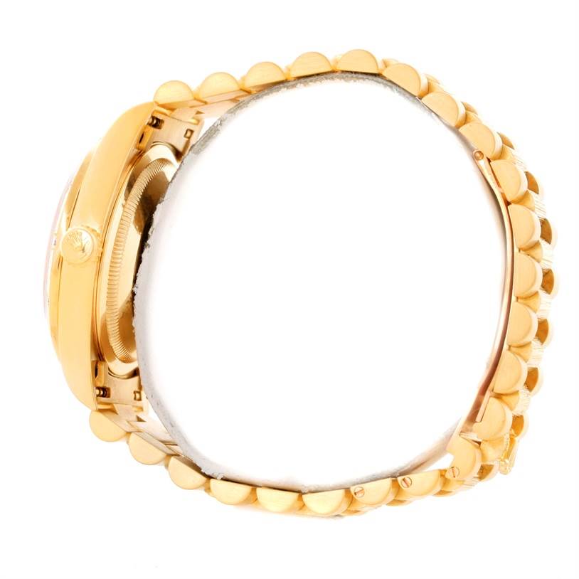 The image shows the side view of a Rolex President 18308 Men's Yellow Gold White Dial 18308 Men's Yellow Gold White Dial model watch, highlighting the crown and bracelet links.