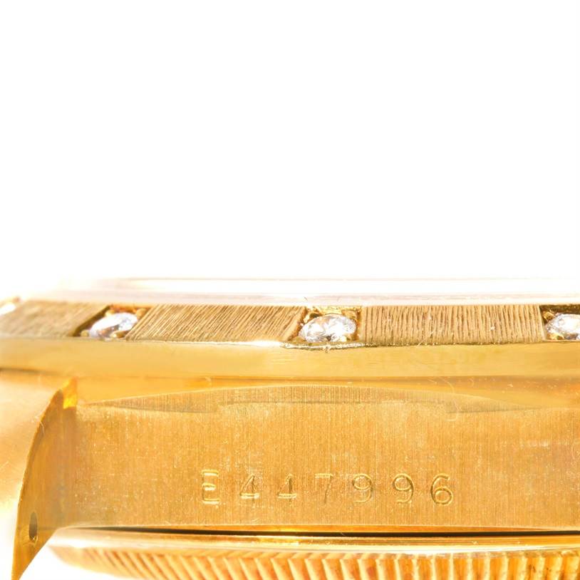 This image shows the side and part of the bezel and serial number of a Rolex President 18308 Men
s Yellow Gold Champagne Dial 18308 Men
s Yellow Gold Champagne Dial model watch.