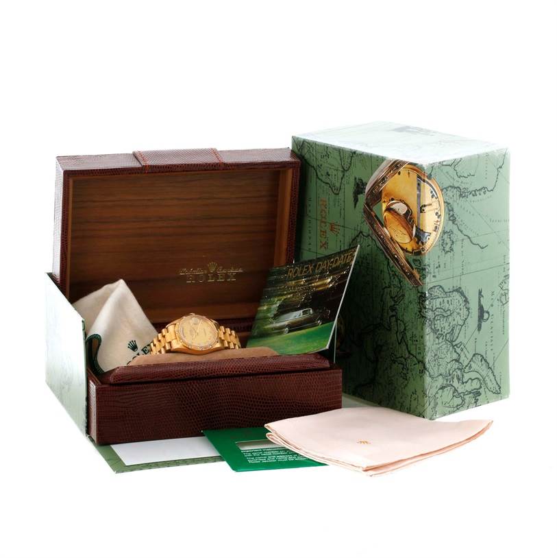 The image shows a Rolex President 18308 Men
s Yellow Gold Champagne Dial 18308 Men
s Yellow Gold Champagne Dial model watch displayed in its box along with related accessories, including a booklet and cloth.