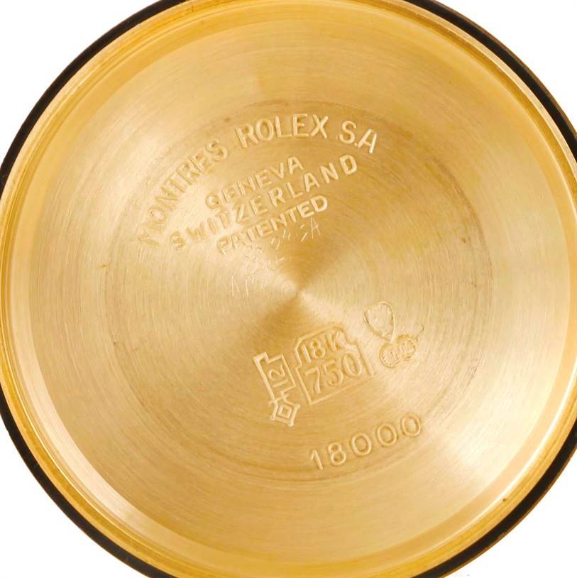 The image shows the inside of the case back of a Rolex President 18038 Men's Yellow Gold White Dial 18038 Men's Yellow Gold White Dial model watch, displaying engravings and gold hallmarks.