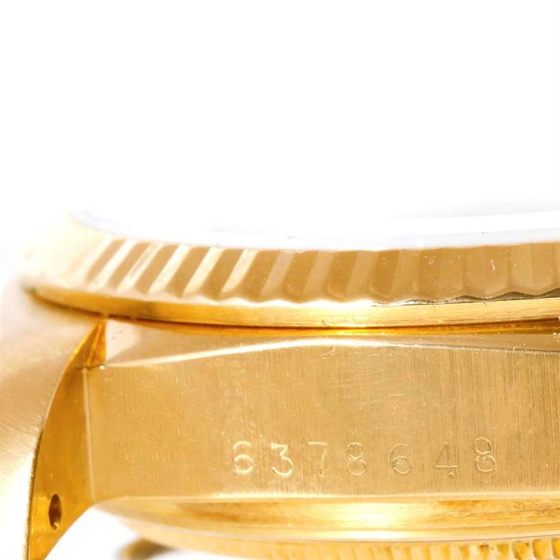 The image shows a side angle close-up of the bezel and part of the case, including a serial number, of a Rolex President 18038 Men's Yellow Gold White Dial 18038 Men's Yellow Gold White Dial model watch.
