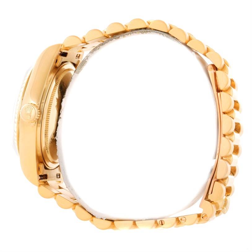 This image shows a side view of a Rolex President 18038 Men's Yellow Gold White Dial 18038 Men's Yellow Gold White Dial model watch displaying its gold case and bracelet.