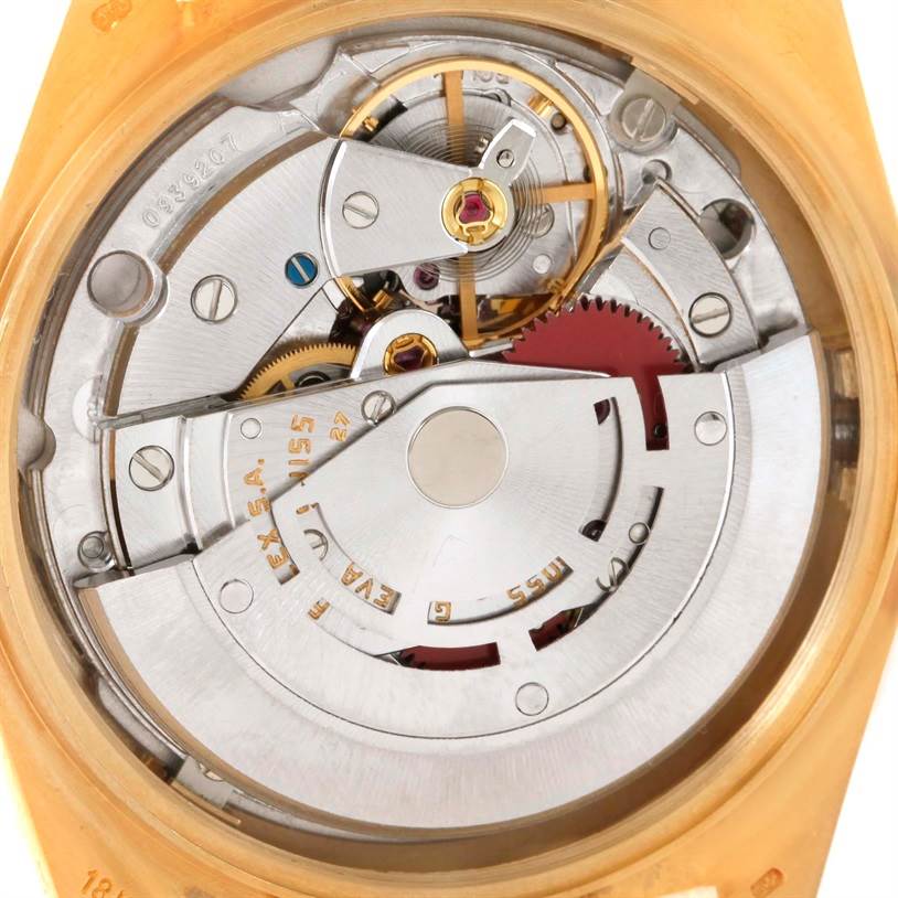 This image shows the intricate internal mechanism of a Rolex President 18038 Men
s Yellow Gold Champagne Dial 18038 Men
s Yellow Gold Champagne Dial model watch, including gears and the rotor.