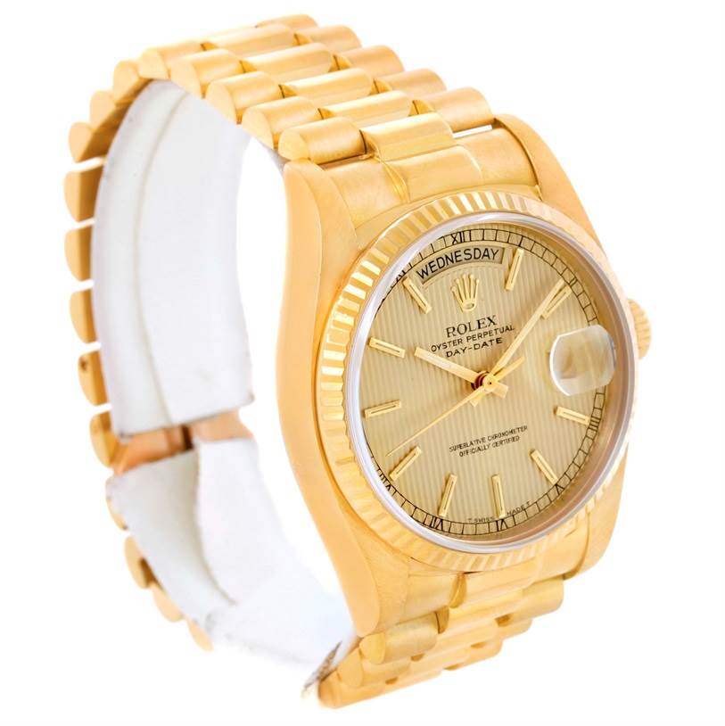 The image shows a Rolex President 18038 Men
s Yellow Gold Champagne Dial 18038 Men
s Yellow Gold Champagne Dial model watch at a three-quarter angle, highlighting the bracelet, face, day, and date display.