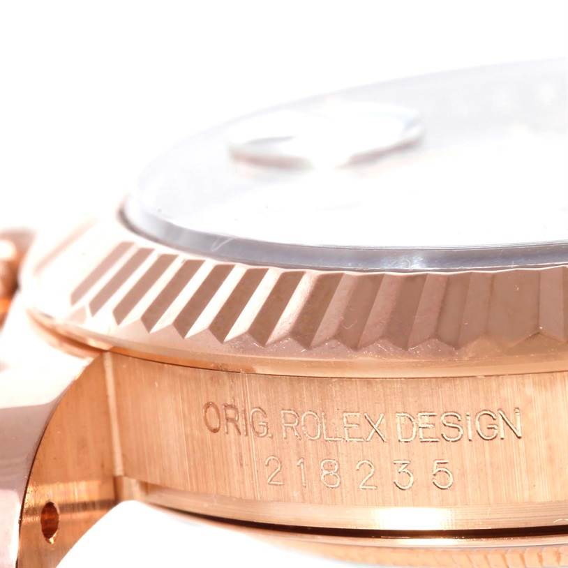 This image shows a close-up angled view of the bezel and case of a Rolex President 218235 Men's Rose Gold Beige Dial 218235 Men's Rose Gold Beige Dial model watch.