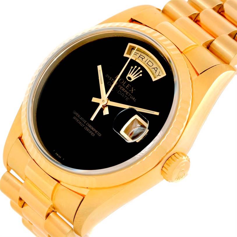 The image shows the Rolex President 18238 Men
s Yellow Gold Champagne Dial 18238 Men
s Yellow Gold Champagne Dial model watch at an angled close-up, highlighting the black dial, day-date display, and gold bracelet.