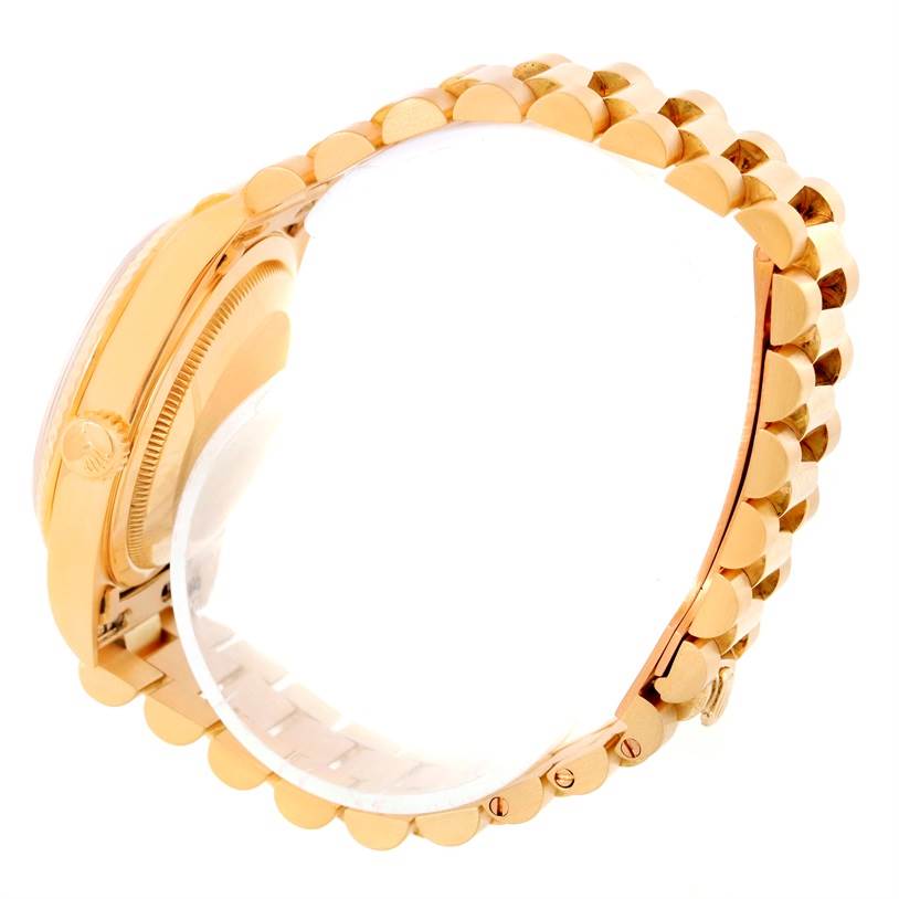 This image shows a side view of the Rolex President 18238 Men
s Yellow Gold Champagne Dial 18238 Men
s Yellow Gold Champagne Dial model watch, focusing on the gold case, fluted bezel, and President bracelet.