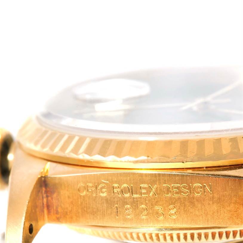 This close-up of a Rolex President 18238 Men
s Yellow Gold Champagne Dial 18238 Men
s Yellow Gold Champagne Dial watch shows the side of the case, bezel, and part of the crystal, with model number 18238 visible.