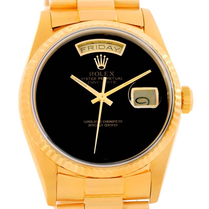 The image shows a frontal view of a Rolex President 18238 Men
s Yellow Gold Champagne Dial 18238 Men
s Yellow Gold Champagne Dial model watch, highlighting the black dial, day display, and the gold case and bracelet.