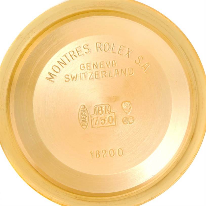 This image shows the inner case back of a Rolex President 18238 Men
s Yellow Gold Champagne Dial 18238 Men
s Yellow Gold Champagne Dial model, made of 18K gold with inscriptions.