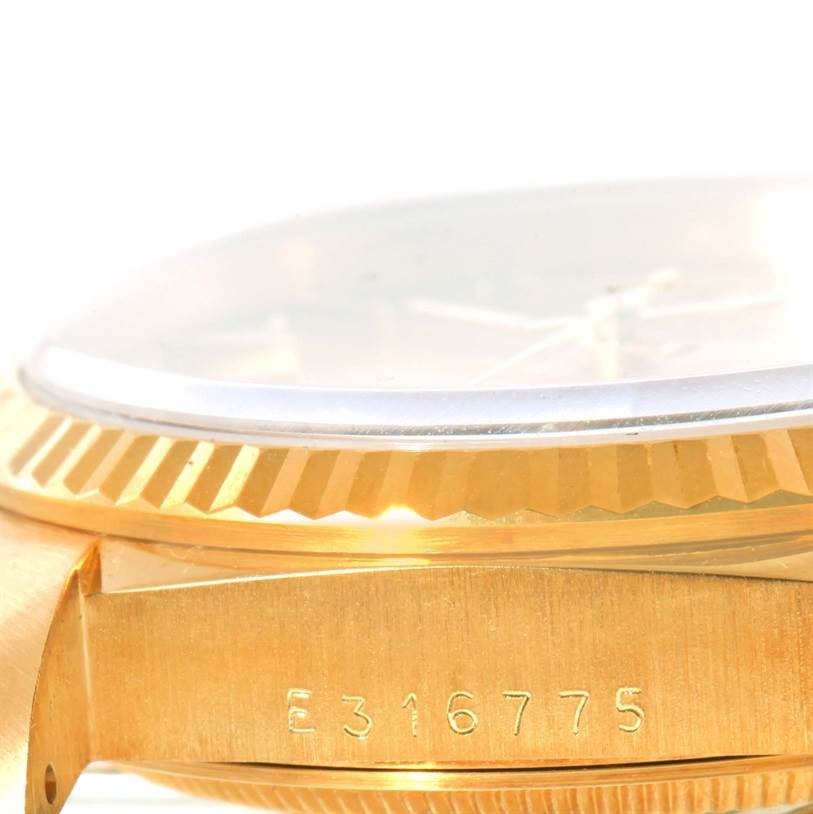The image shows a close-up side view of the case and serial number of a Rolex President 18238 Men
s Yellow Gold Champagne Dial 18238 Men
s Yellow Gold Champagne Dial model watch.
