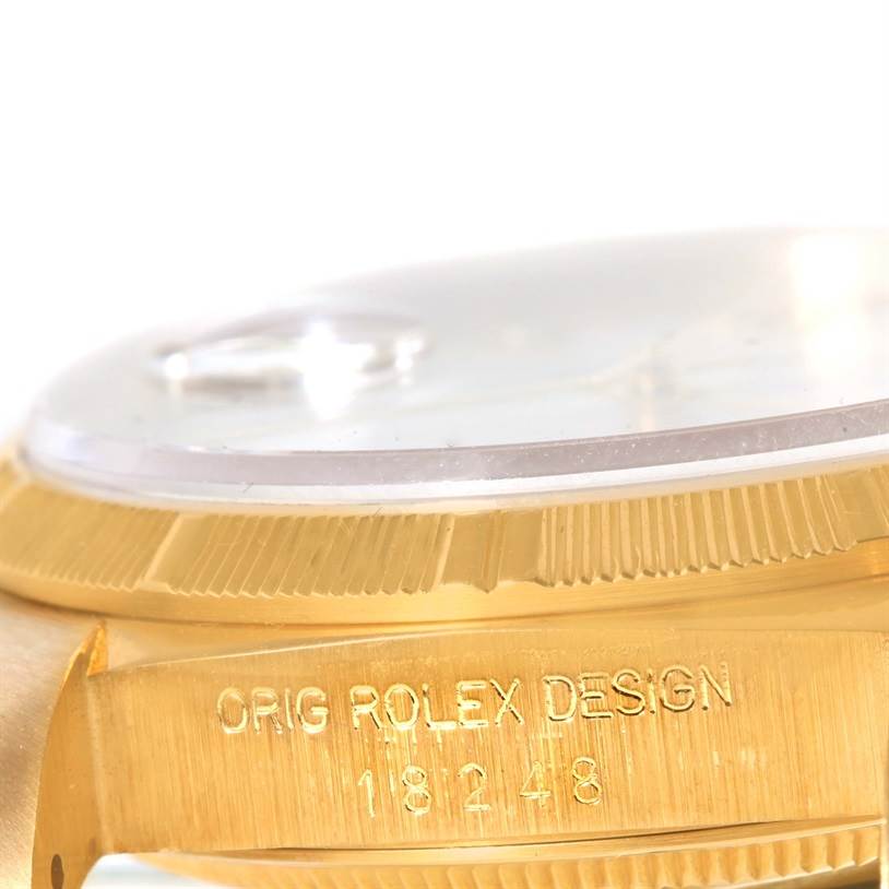 This image shows a side view of the bezel, crystal, and part of the case of a Rolex President 18248 Men's Yellow Gold White Dial 18248 Men's Yellow Gold White Dial model.