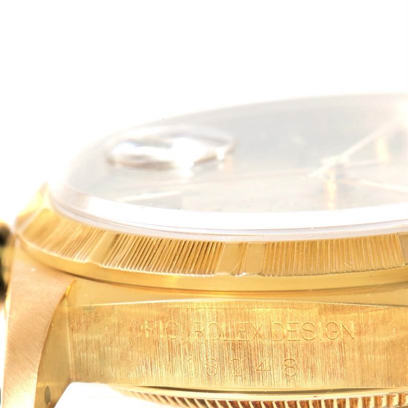 The image shows a close-up side angle of the Rolex President 18248 Men
s Yellow Gold Champagne Dial 18248 Men
s Yellow Gold Champagne Dial model, focusing on the case and bezel.