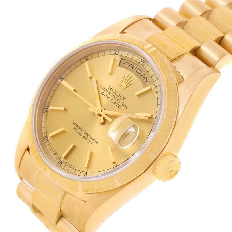 The image shows a close-up angled view of a gold Rolex President 18248 Men
s Yellow Gold Champagne Dial 18248 Men
s Yellow Gold Champagne Dial Day-Date watch, highlighting the dial, fluted bezel, and part of the bracelet.
