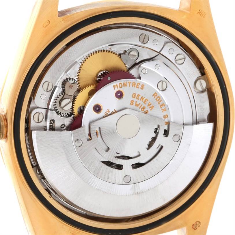 This image shows the open case back of a Rolex President 18248 Men
s Yellow Gold Champagne Dial 18248 Men
s Yellow Gold Champagne Dial watch, revealing its internal movement and gears.