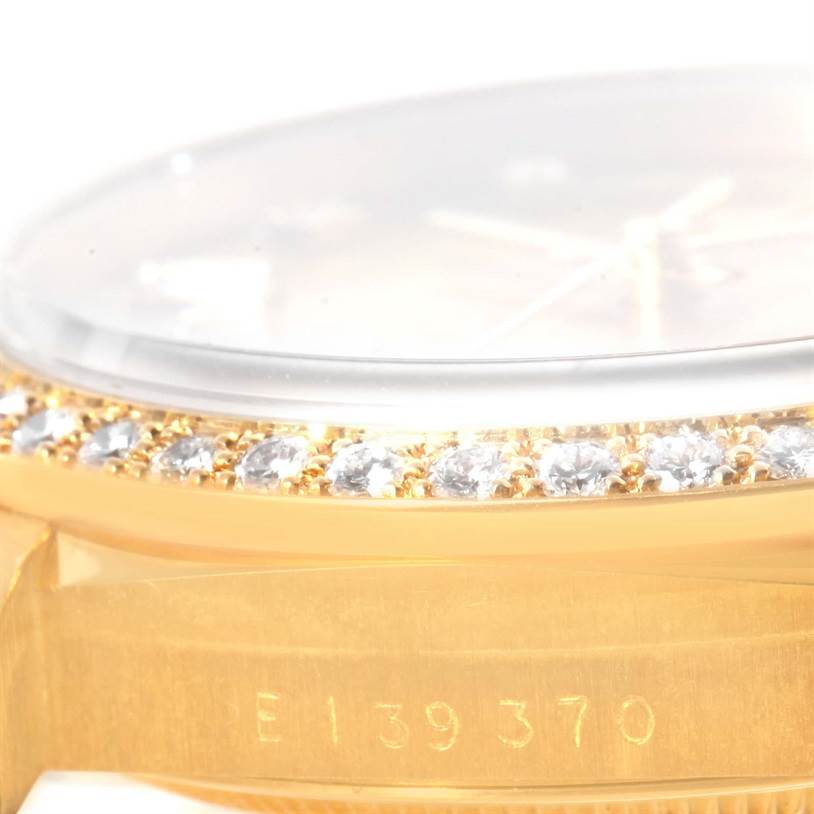 This close-up angle shows the bezel with diamonds and case edge, with partial serial number visible, of the Rolex President 18348 Men
s Yellow Gold Champagne Dial 18348 Men
s Yellow Gold Champagne Dial model watch.