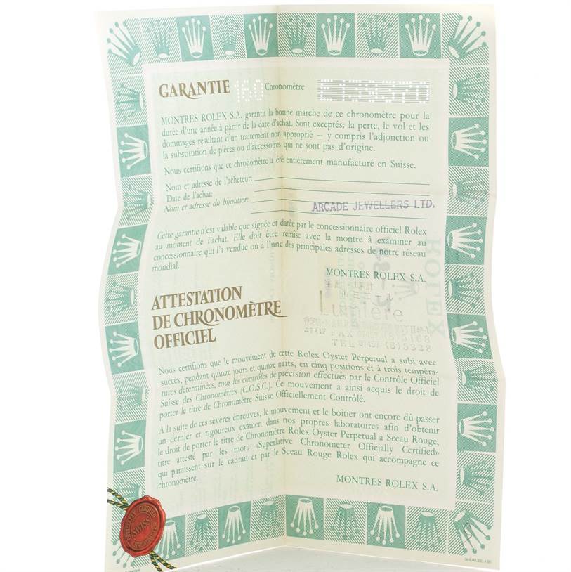 The image shows a warranty certificate and chronometer certification for a Rolex President 18348 Men
s Yellow Gold Champagne Dial 18348 Men
s Yellow Gold Champagne Dial model watch.