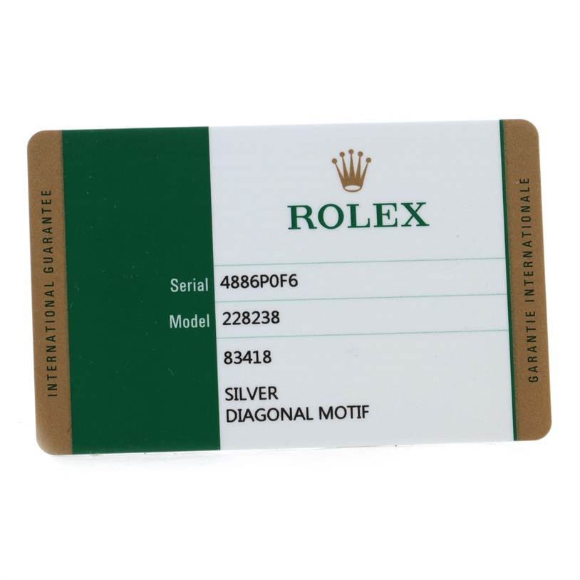 The image shows a guarantee card for the Rolex President 228238 Men's Yellow Gold Silver Dial 228238 Men's Yellow Gold Silver Dial model watch.