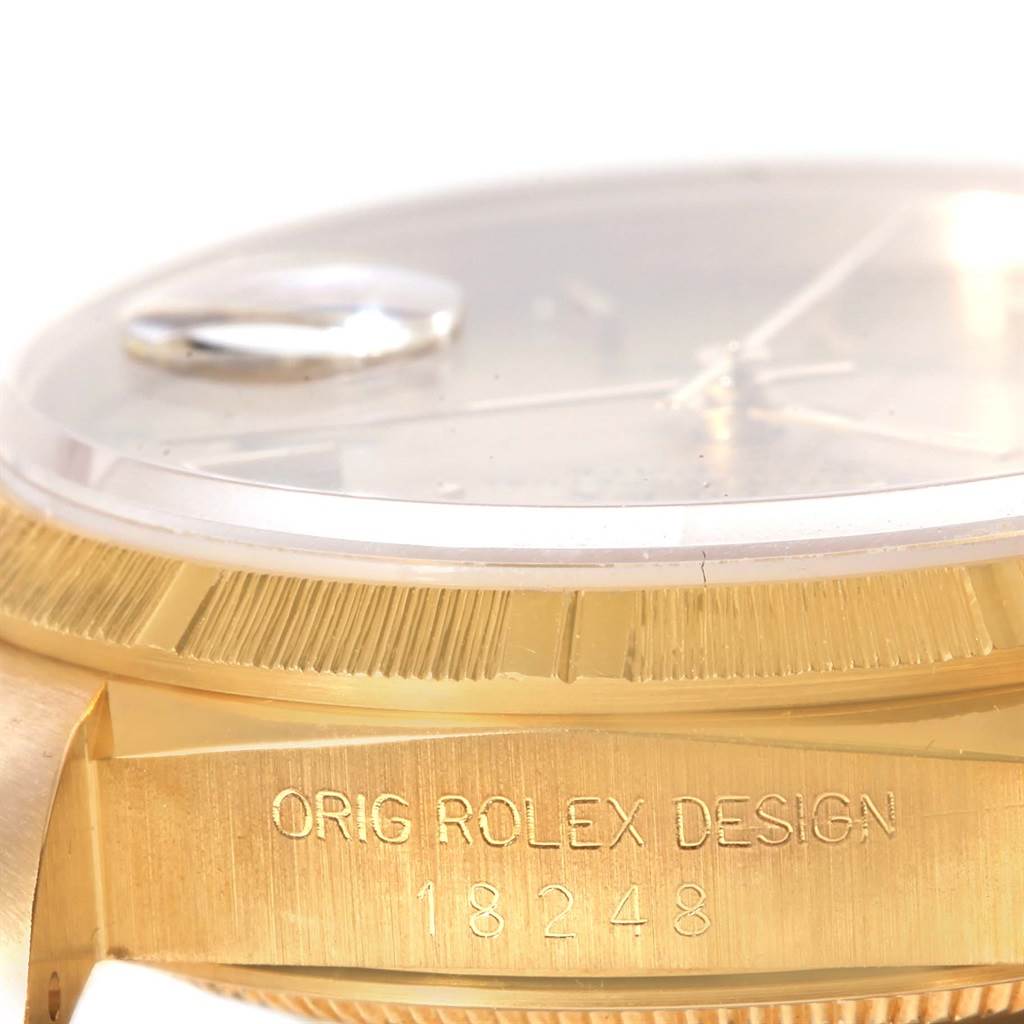 This image shows a close-up, side profile of a Rolex President 18248 Men
s Yellow Gold Champagne Dial 18248 Men
s Yellow Gold Champagne Dial model watch highlighting the bezel, crystal, case, and model number "18248".