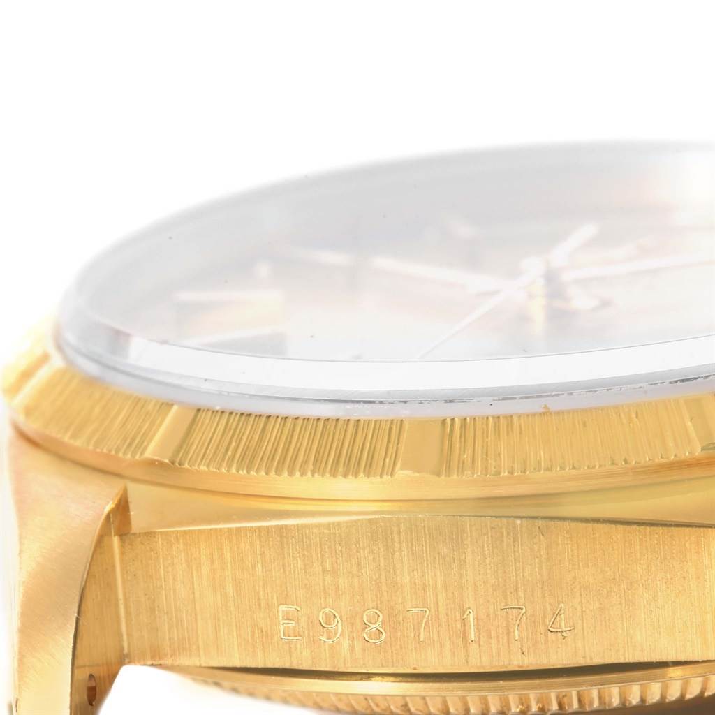 This close-up shows the side view of the Rolex President 18248 Men
s Yellow Gold Champagne Dial 18248 Men
s Yellow Gold Champagne Dial model, highlighting the case, crystal, and serial number.