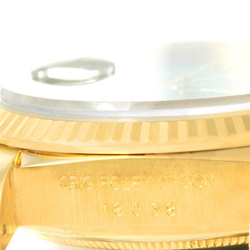 The image shows a close-up side angle of a Rolex President 18038 Men
s Yellow Gold Mother of Pearl Dial 18038 Men
s Yellow Gold Mother of Pearl Dial watch, highlighting the bezel and engraved model number 18038.