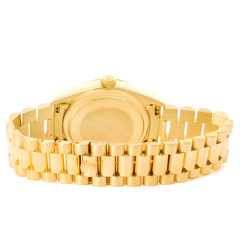 This image shows the back case and band of a Rolex President 18038 Men
s Yellow Gold Mother of Pearl Dial 18038 Men
s Yellow Gold Mother of Pearl Dial model watch, highlighting its gold finish.