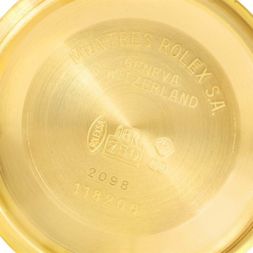 The image shows the inside case back of a Rolex President 118238 Men
s Yellow Gold Black Dial 118238 Men
s Yellow Gold Black Dial model watch, featuring engravings and hallmark stamps.