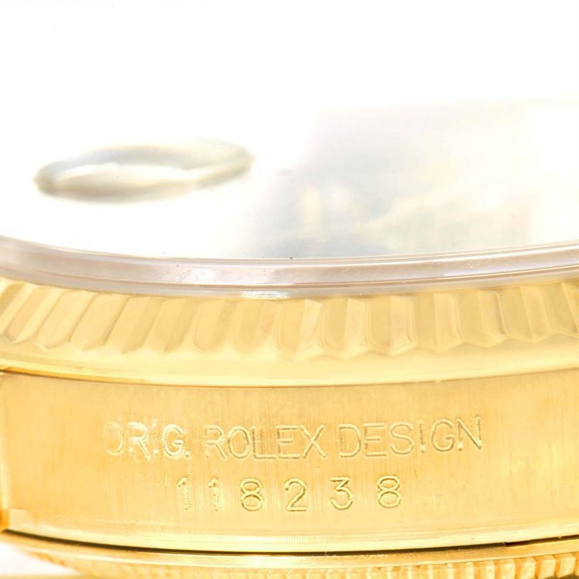 The image shows a close-up side view of the bezel and case of a Rolex President 118238 Men
s Yellow Gold Black Dial 118238 Men
s Yellow Gold Black Dial model, displaying the model number "118238."