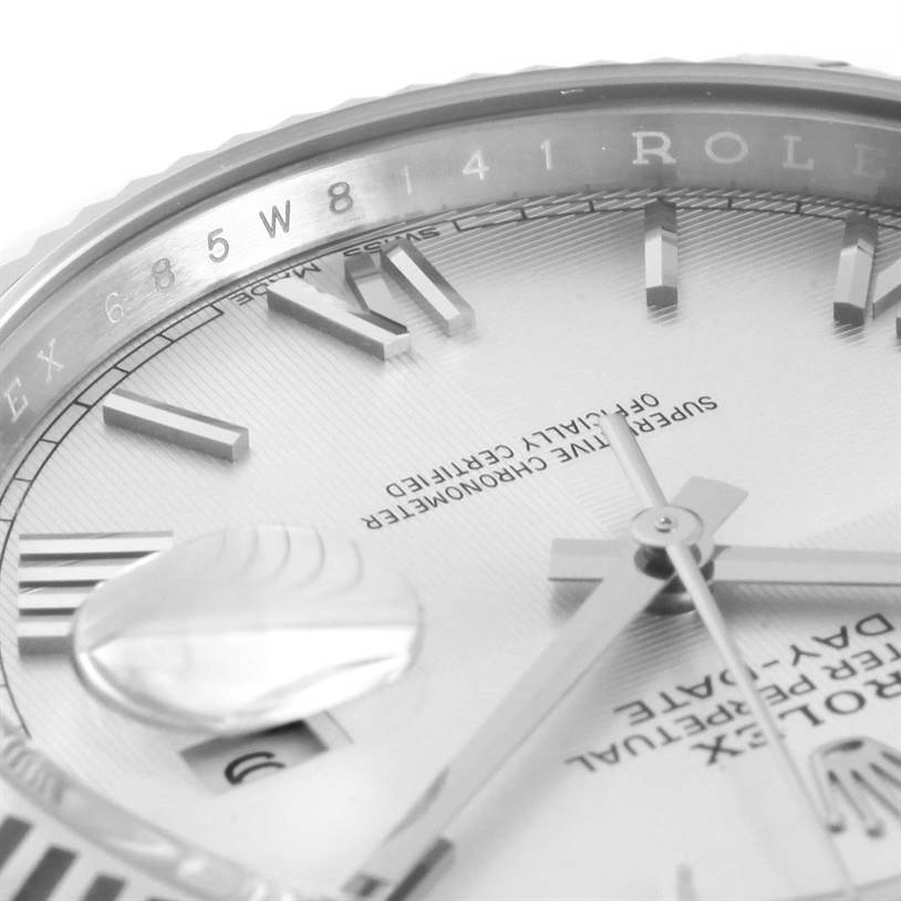 This image shows a close-up angle of the dial and part of the bezel of a Rolex President 228239 Men's White Gold Silver Dial 228239 Men's White Gold Silver Dial watch.