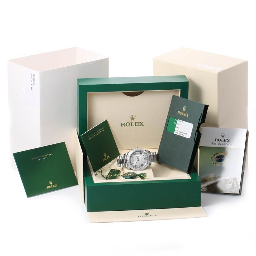 The image shows a Rolex President 228239 Men's White Gold Silver Dial 228239 Men's White Gold Silver Dial model watch in its open box with accompanying paperwork and accessories, viewed from the front.