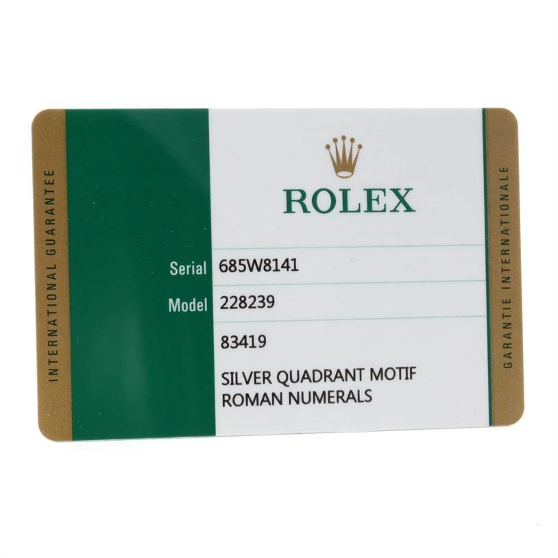 The image shows an international guarantee card for a Rolex President 228239 Men's White Gold Silver Dial 228239 Men's White Gold Silver Dial model with serial and model numbers listed.