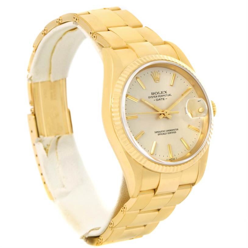 The image shows a side angle of the Rolex President 15238 Men
s Yellow Gold Silver Dial 15238 Men
s Yellow Gold Silver Dial model watch, displaying its gold bracelet, dial, and fluted bezel.