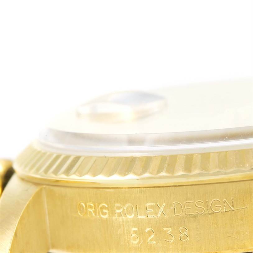 This close-up image shows the side case and serial inscriptions underneath the bezel of a Rolex President 15238 Men
s Yellow Gold Silver Dial 15238 Men
s Yellow Gold Silver Dial model watch.