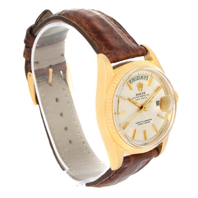 The image shows a Rolex President 1803 Men
s Yellow Gold Silver Dial 1803 Men
s Yellow Gold Silver Dial model watch at a three-quarter angle, displaying the face, bezel, case, and leather strap.