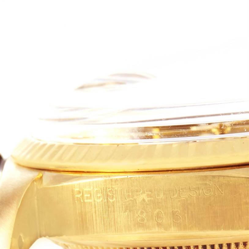 This image shows a close-up side view of the case and bezel of the Rolex President 1803 Men
s Yellow Gold Silver Dial 1803 Men
s Yellow Gold Silver Dial Model 1803 watch.