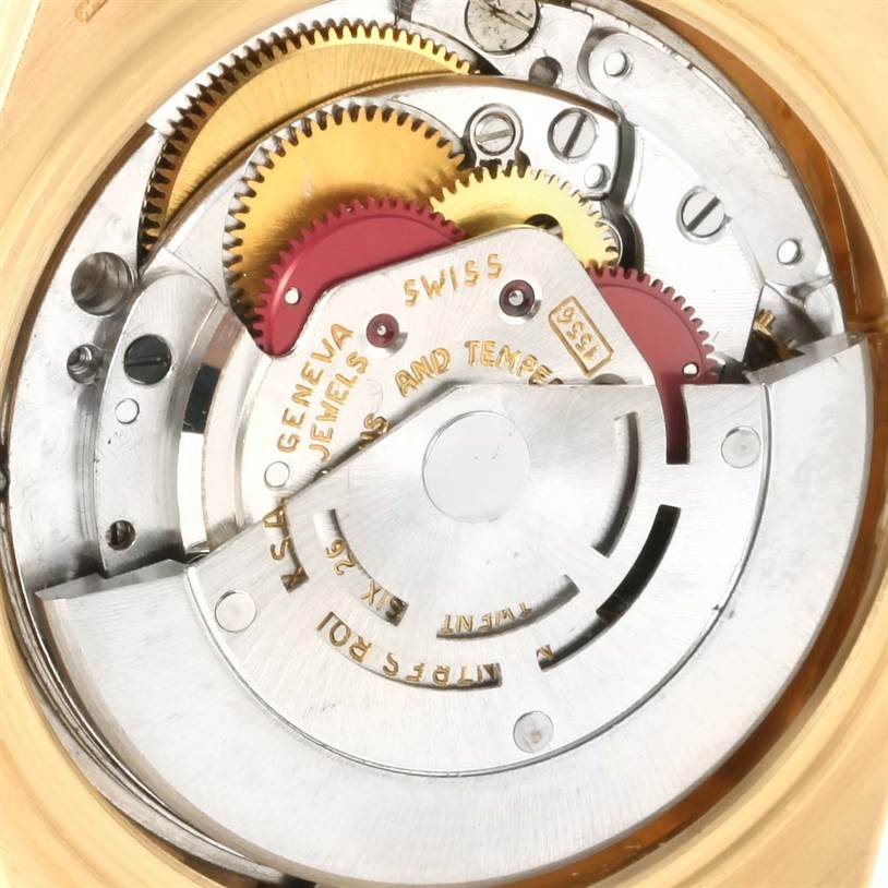 This image shows the intricate movement mechanism inside the Rolex President 1803 Men
s Yellow Gold Silver Dial 1803 Men
s Yellow Gold Silver Dial model watch, with its gears and components visible.