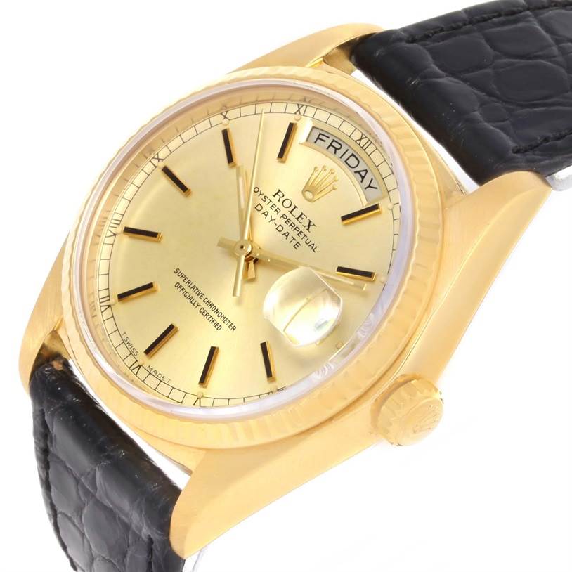 The image shows a gold Rolex President 18038 Men
s Yellow Gold Champagne Dial 18038 Men
s Yellow Gold Champagne Dial model watch at an angle, highlighting its face, bezel, crown, and part of the black leather strap.