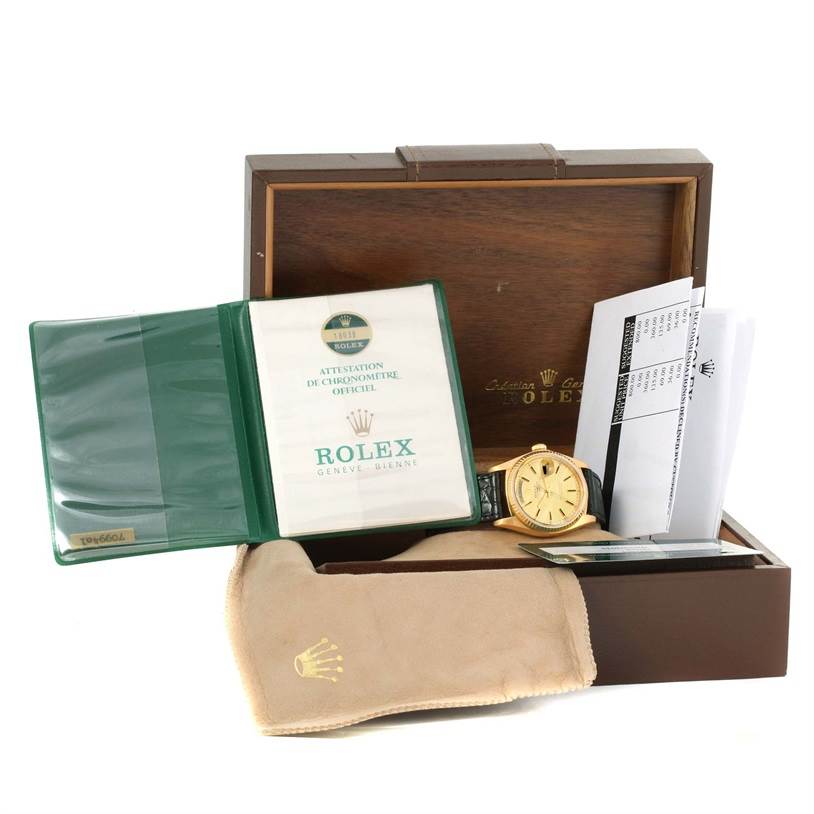 The image shows a Rolex President 18038 Men
s Yellow Gold Champagne Dial 18038 Men
s Yellow Gold Champagne Dial model watch along with its box, documentation, and a protective pouch.