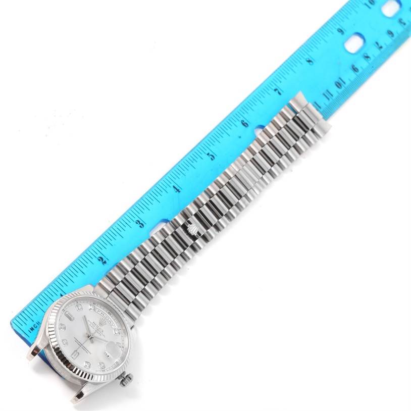 The image shows a Rolex President 118239 Men's White Gold Silver Dial 118239 Men's White Gold Silver Dial model watch laid flat with a blue ruler alongside to measure the bracelet length.