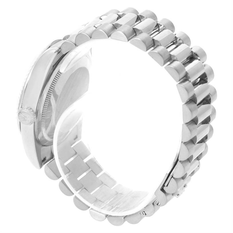 This image shows the side and partial bracelet of a Rolex President 118239 Men's White Gold Silver Dial 118239 Men's White Gold Silver Dial model watch, with focus on the crown and links.