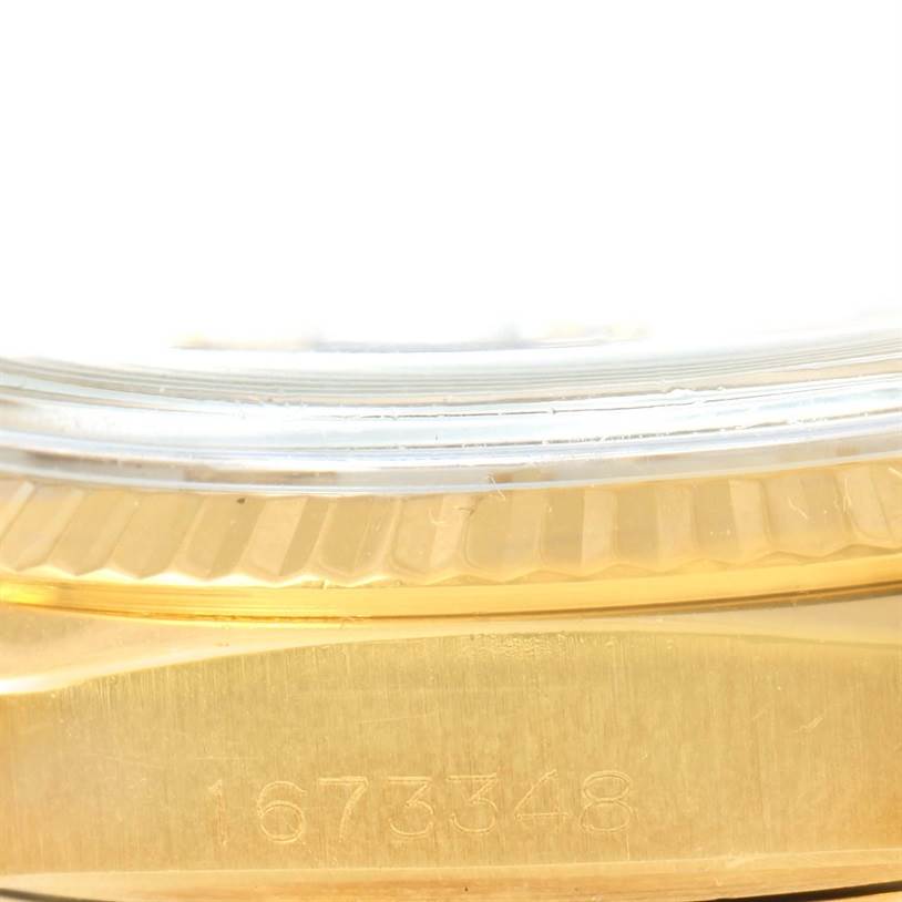 The image shows a close-up of the serial number engraving on the side of a Rolex President 1803 Men
s Yellow Gold Silver Dial 1803 Men
s Yellow Gold Silver Dial watch.