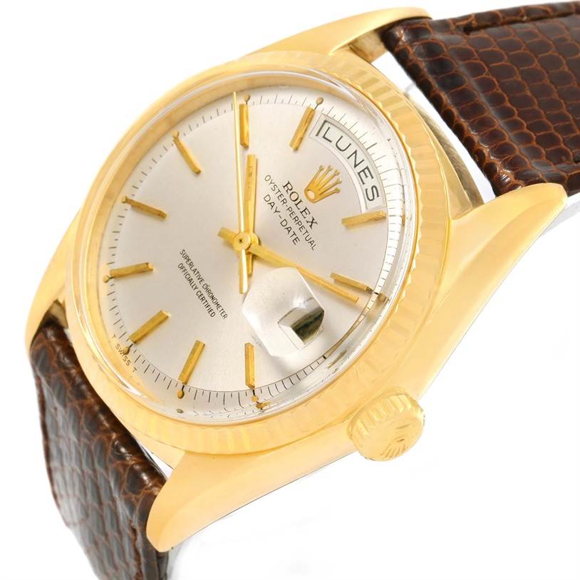 This image shows a partial front-right view of the Rolex President 1803 Men
s Yellow Gold Silver Dial 1803 Men
s Yellow Gold Silver Dial watch, highlighting the dial, day-date display, and crown.